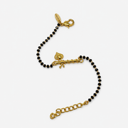 Women Thakur Ji Bansuri 22k Gold-plated Brass Bracelet with Black Onyx