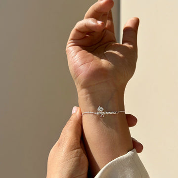 Silver Krishna bansuri flute bracelet motif detail