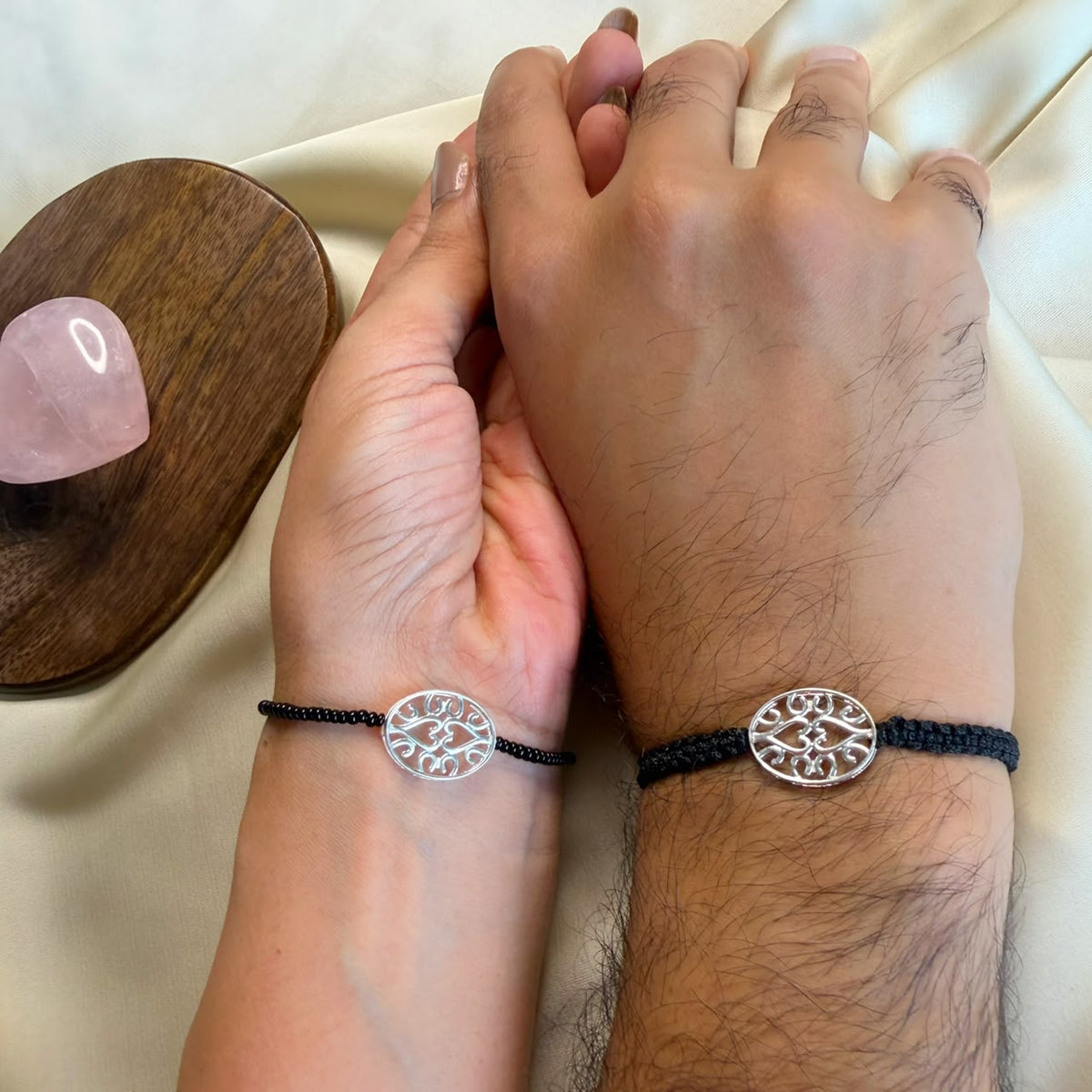 Couple EvilEye Heartline silver bracelets worn together, Amaltaas