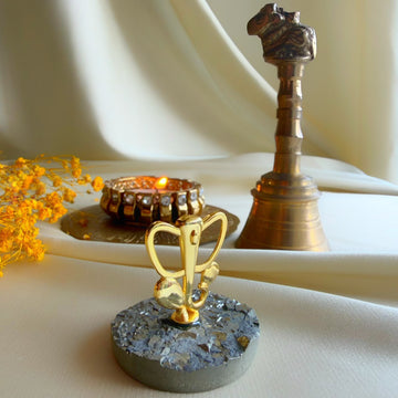 Ganesh Ji gold-plated motif on pyrite with diya and brass bell, Diwali gift