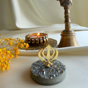 Khanda Waheguru's Blessings on pyrite gemstone with diya and brass bell